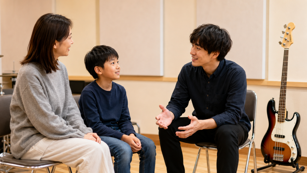 保護者と子どもが学校予定に合わせてベースレッスン日を相談する様子
