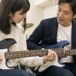 調布の音楽スタジオで初心者がマンツーマンギターレッスンを受ける様子